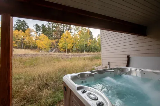 Relax after a day of adventure in the large hot tub.