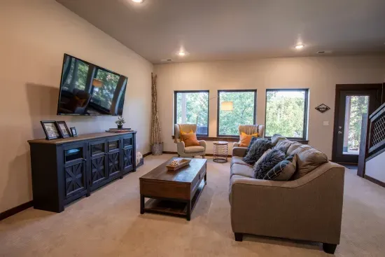 The lower level living room is spacious and well thought out.