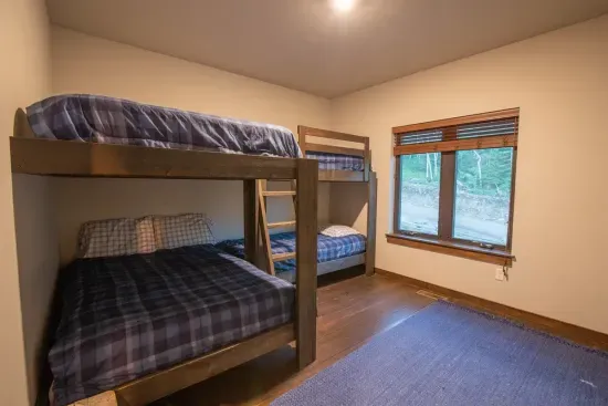 The upper level bunkroom is a great place for the kiddos to get rested up for another day in the hills.