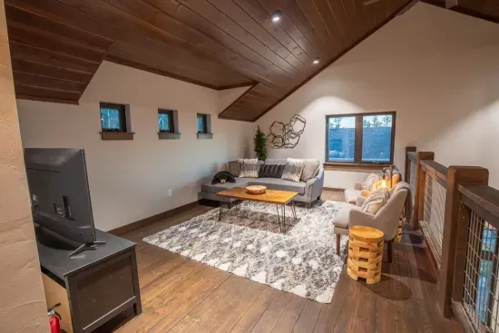 The sitting area in the loft is roomy and comfortable. With a smart tv you'll be able to kick back and relax.
