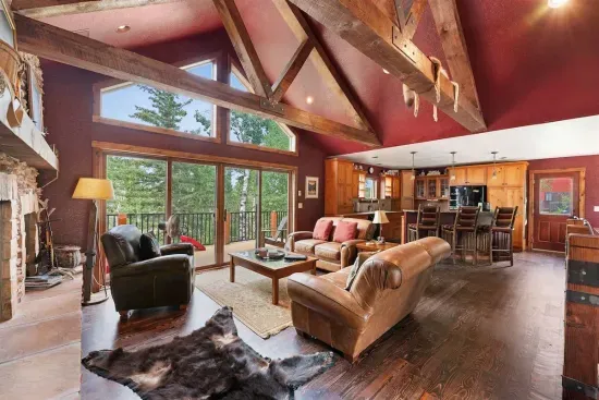 The wall of glass brings the beauty of the Black Hills into the cabin.