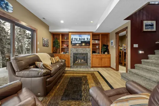 Warm up around the lower level gas fireplace.