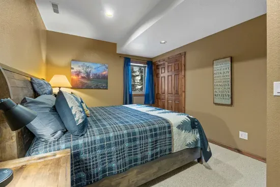 Relax and reset in the large king bed on the lower level.