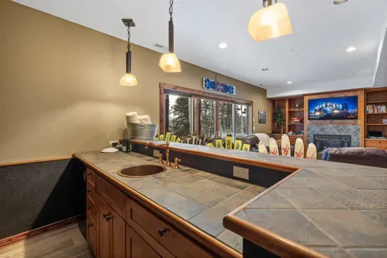 Enjoy the game while crafting cocktails at the bar.