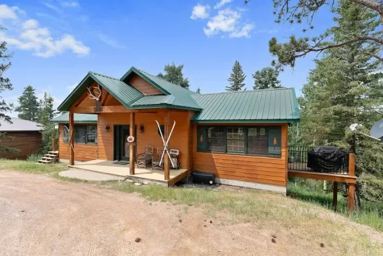 The front porch of the cabin invites you into the majesty of Terry Peak.