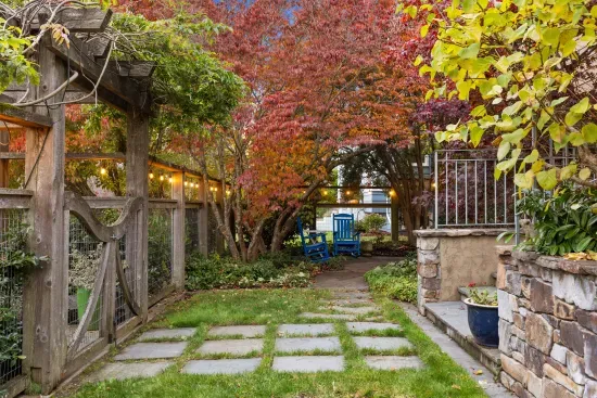 Well lit garden with rocking chairs