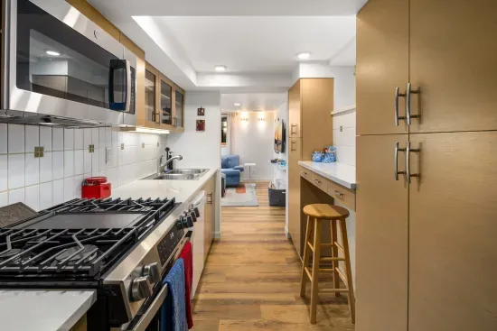 Plenty of storage in kitchen cabinets for groceries.