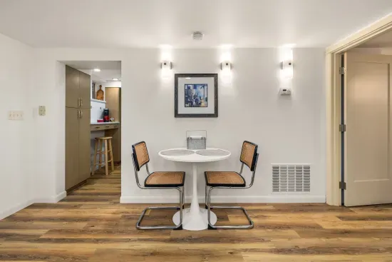 Dining table for two plus a counter seating in the kitchen.