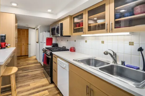 Your fully stocked galley kitchen with toaster, Keurig coffee maker, microwave, blender, full size refrigerator, dishwasher, gas stove and oven.