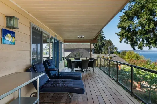 Two chaise lounges on a covered and heated deck means guests can enjoy the view year-round. Blankets are provided for curling up early in the morning to watch the sunrise.