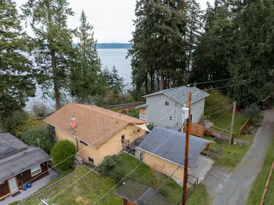 Aerial view of carport from alley access.  The covered carport parking has motion detector lights and offers a stairless entry for guests.
