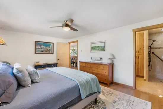 The main bedroom offers wide doors to a spacious ensuite ADA bathroom