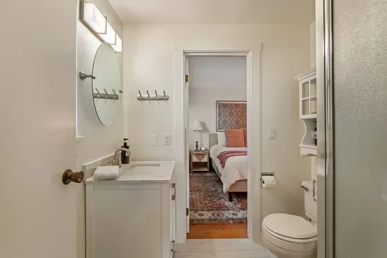 2nd Bedroom with Queen bed and adjoining semi-private bathroom with corner shower. Comes with hair dryer,  and unscented shampoo, conditioner, and body wash.