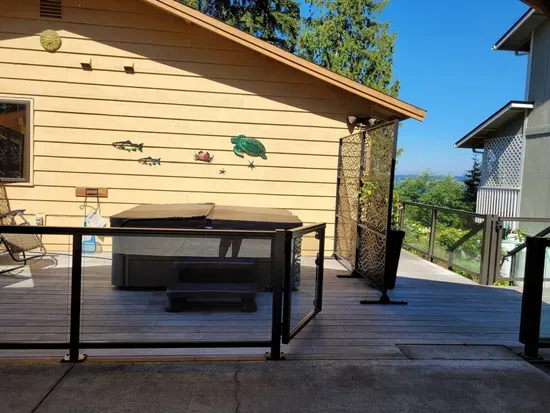 For folks who want to avoid stairs, parking in the carport off of the alley is available - the wide glass gate is perfect for folks who need ADA access or stairless entry.   And dogs can stay safe in the fenced area that surrounds the house.