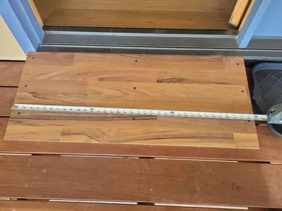 The glass door on  the deck facing the water has a ramp and a wide opening.
