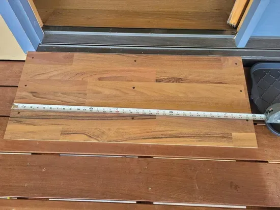 The glass door on  the deck facing the water has a ramp and a wide opening.