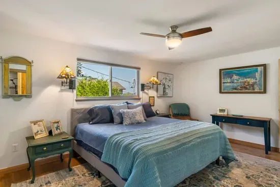 King hybrid mattress and block out blinds with ceiling fan in the main bedroom