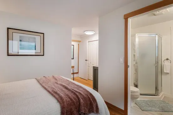 2nd Bedroom with adjoining bathroom with corner shower
