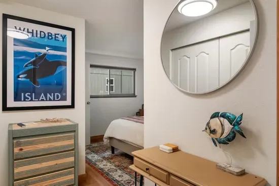 2nd Bedroom with Queen Bed, dresser, large mirror with blackout blinds. Includes two full closets and lots of storage, plus  plenty of room to get dressed  in front of a full length mirror.