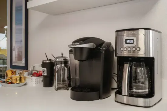 coffee station with Cuisinart Coffee Maker, a Keurig, and a French Press
