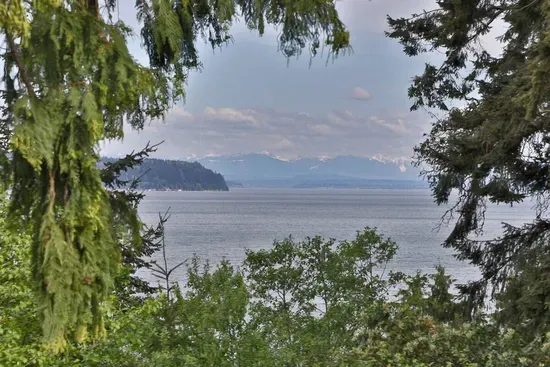 Mountain and water views from the covered and heated deck.