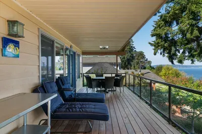 Spacious deck with food prep station near the gas BBQ grill