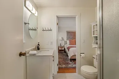 3/4 Shower Bathroom off of Queen Bedroom  features a corner walk-in shower.