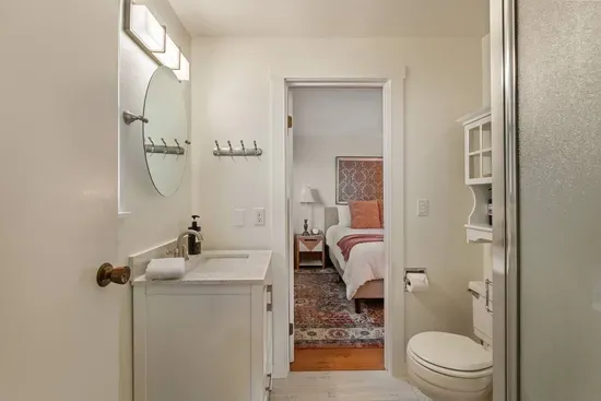 3/4 Shower Bathroom off of Queen Bedroom  features a corner walk-in shower.