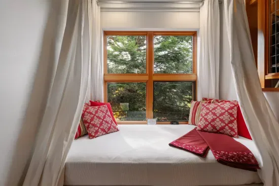 On the stairway leading to the extra large loft, there is a day bed for napping, sleeping, curling up with a book, or just enjoying the view.