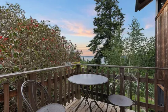 Just off of the kitchen, guests can enjoy the water and mountain views on the deck.