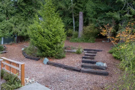 These stairs lead to a private trail that connects to a 3/4-mile hiking path, taking you directly to Possession Point Waterfront Park.