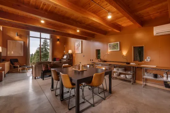 In addition to the six seats at the square table, there are two counter stools along the window counter.