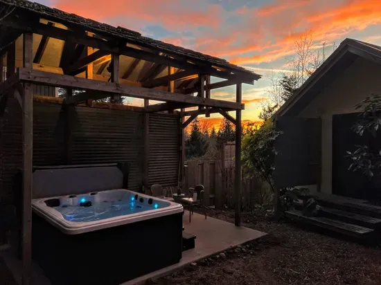 Enjoy soaking under the stars just steps away from a King Bedroom