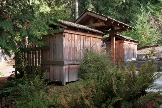 Near the driveway, you'll find sheds containing garbage cans and recycling bins for your convenience.