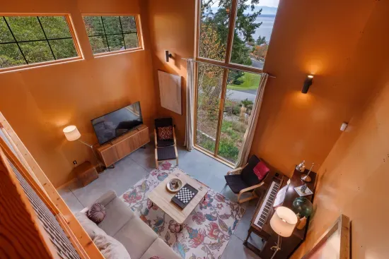 The view from the expansive loft of the living room and 14 foot tall scenic window.