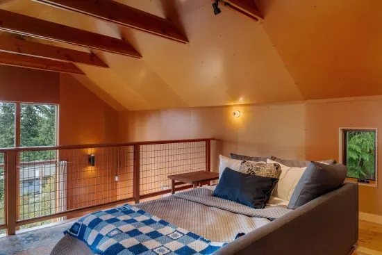 The sofa bed made up into a queen bed.