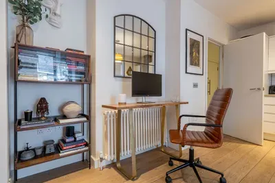 A dedicated desk with an external monitor and fast WiFi — a proper setup for remote work, not a laptop balanced on your knees. Soho's cafés are downstairs when you need a change of scene.