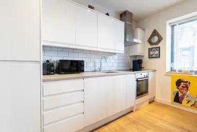 Fully equipped — induction hob, oven and Nespresso machine, plus an LED-lit breakfast/ dining bar for found. Morning coffee or nightcap sorted.