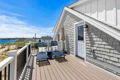 Sunny private deck with lounge chairs and relaxing water views