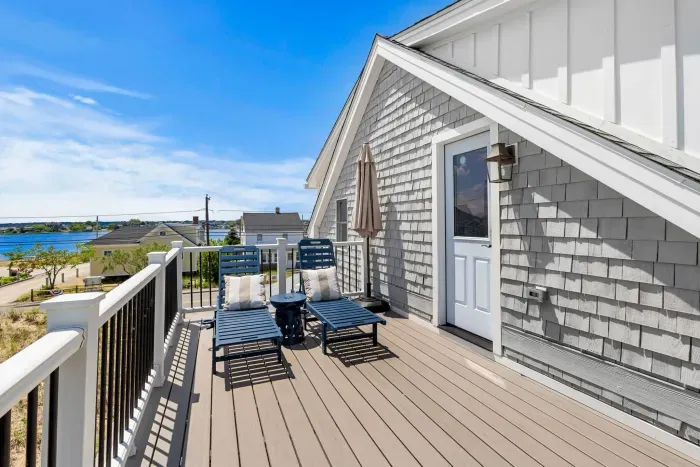 Sunny private deck with lounge chairs and relaxing water views