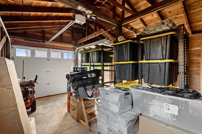 Spacious wood-beam garage with organized storage and easy access