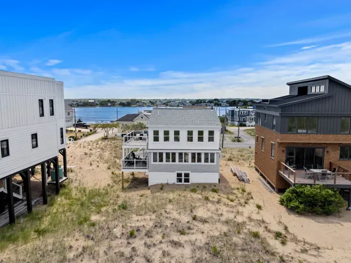 Coastal beach house with water views and a relaxing covered deck