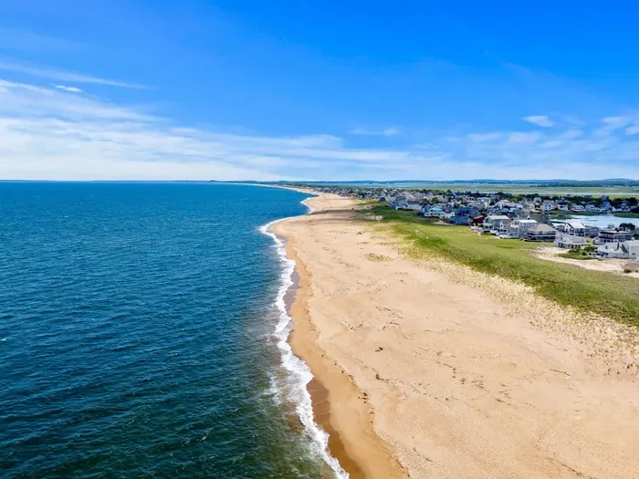 Endless sandy shoreline and sweeping ocean views just steps away