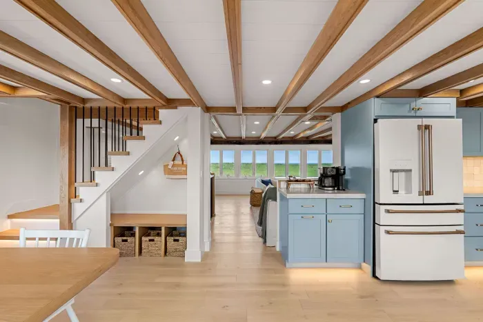 Bright coastal-style kitchen with exposed beams and airy open layout