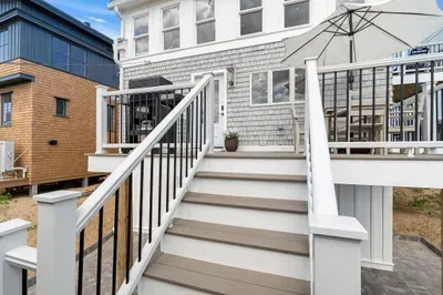 Spacious raised deck with outdoor seating and stylish modern finishes
