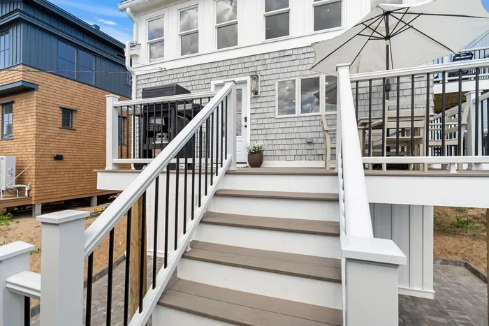 Spacious raised deck with outdoor seating and stylish modern finishes
