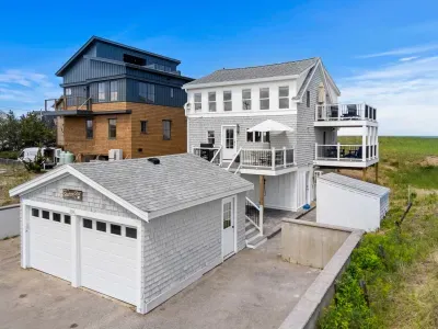 Charming beach house with multiple decks, garage, and coastal views