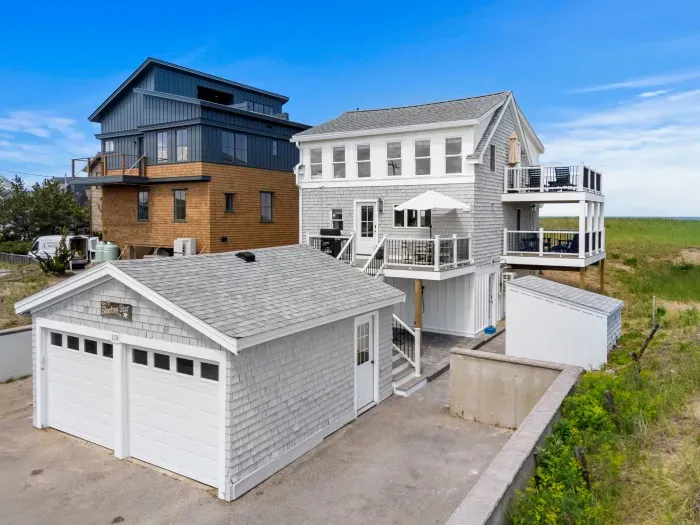 Charming beach house with multiple decks, garage, and coastal views