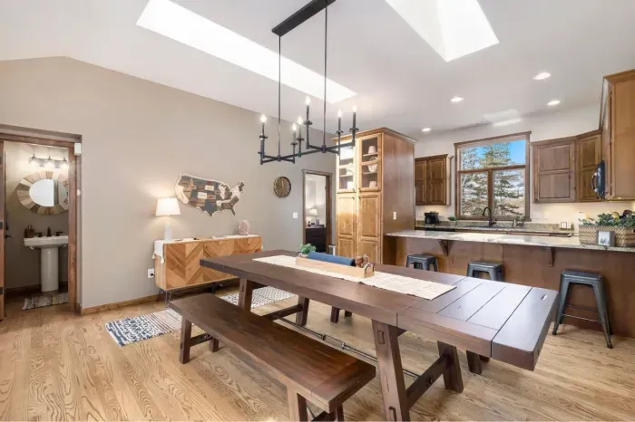 Large dining table to enjoy meals, play games and make family/friend memories. 3 additional bar stools for extra seating or visiting while the cook is in the kitchen.