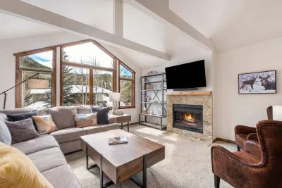 A spacious living area perfect for making memories.
An inviting open living room with a cozy gas fireplace and lots of Estes Park hiking and history books for your reading during your stay.